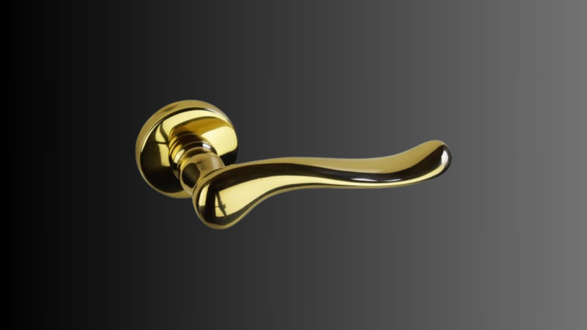 Un primo piano di una maniglia dorata su sfondo nero.