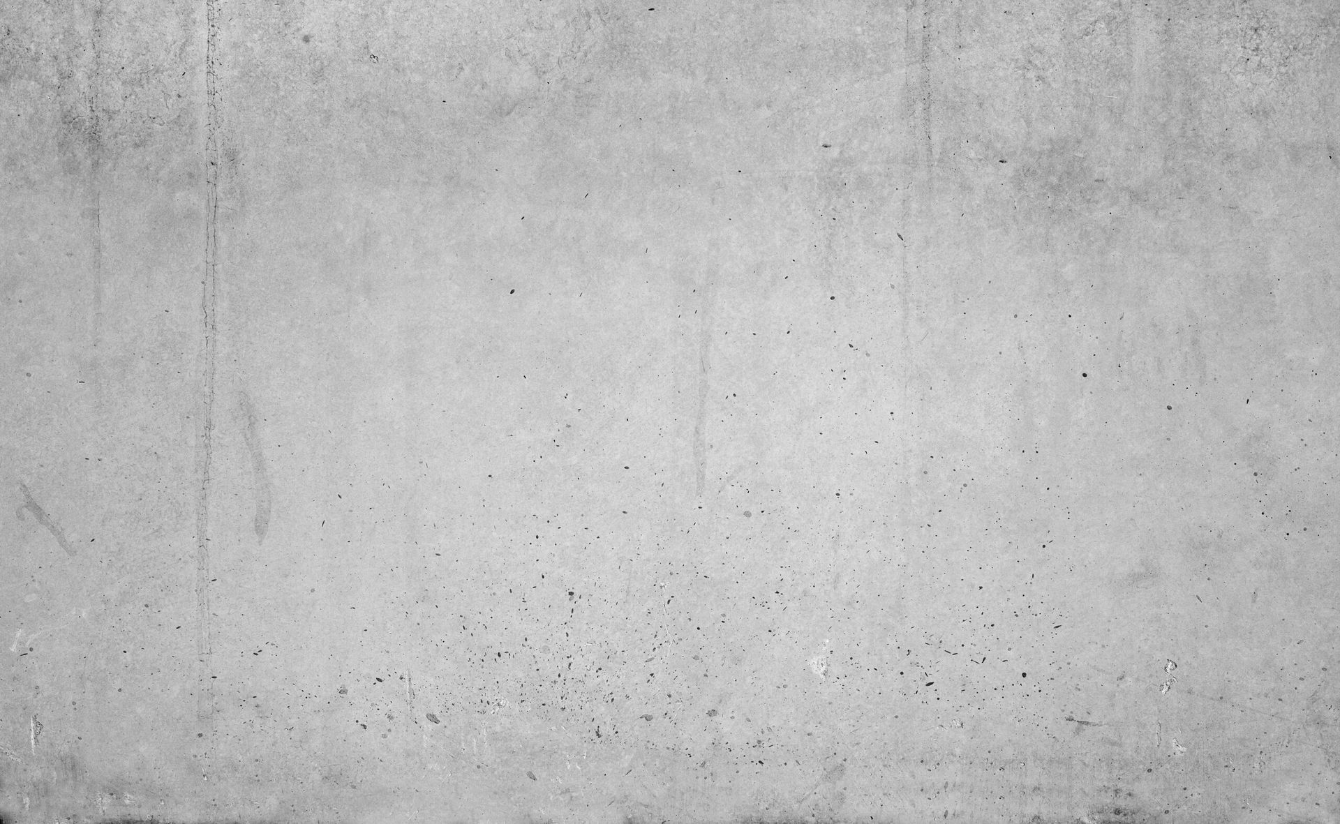 Un primo piano di una struttura di muro di cemento grigio.