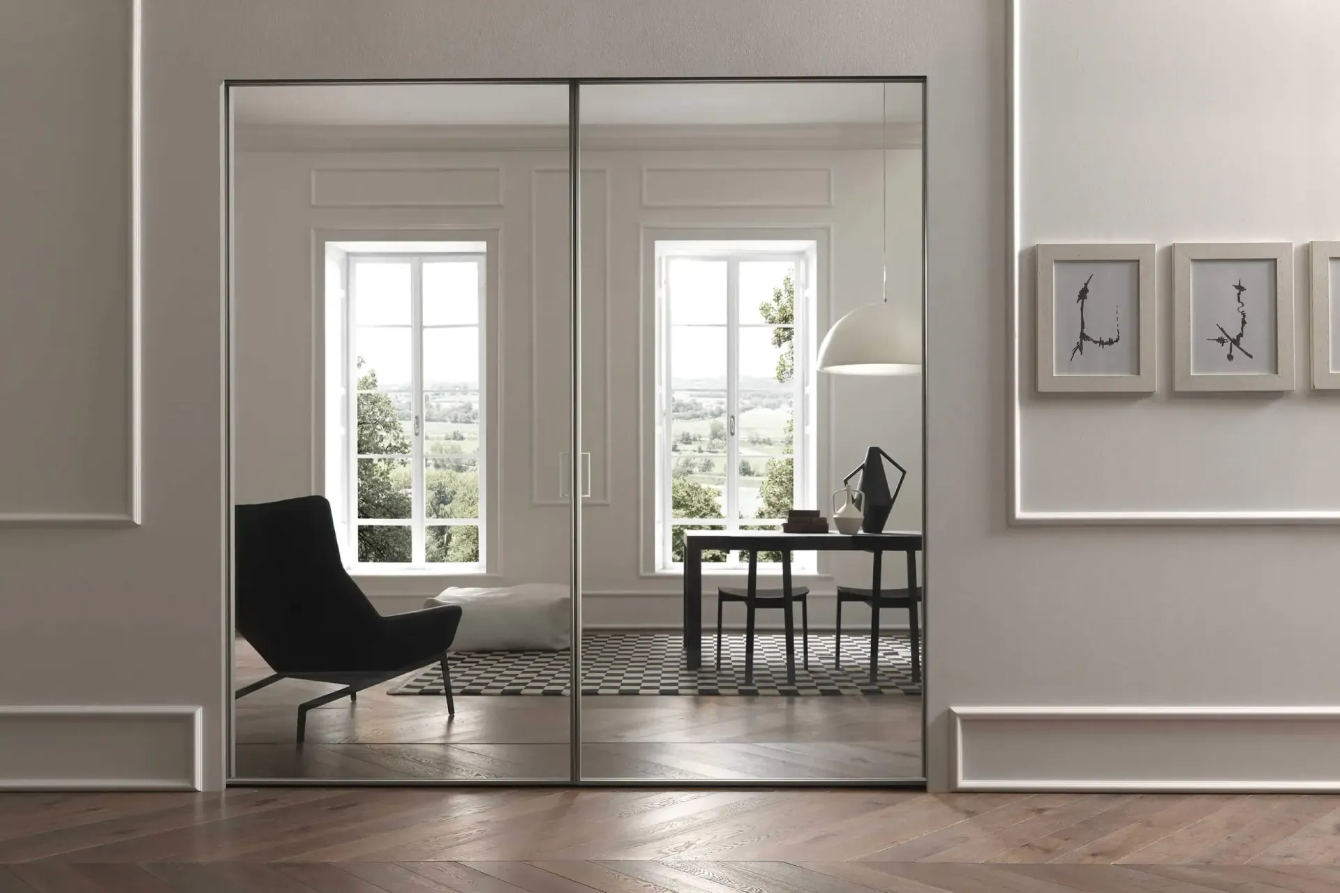 Un soggiorno con una porta scorrevole in vetro che conduce alla sala da pranzo.