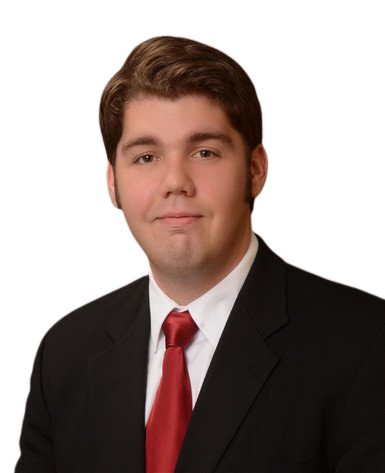 professional photo of Daniel Wheeler wearing a black suit with a red tie