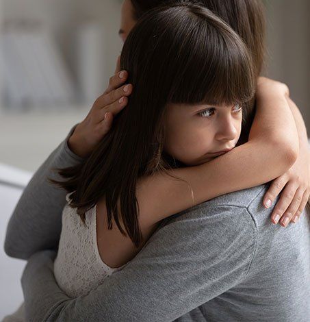 Little Girl Hugging Her Guardian — Springfield, MO — Dunn Law Firm LLC