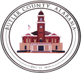 a seal for butler county alabama with a clock tower