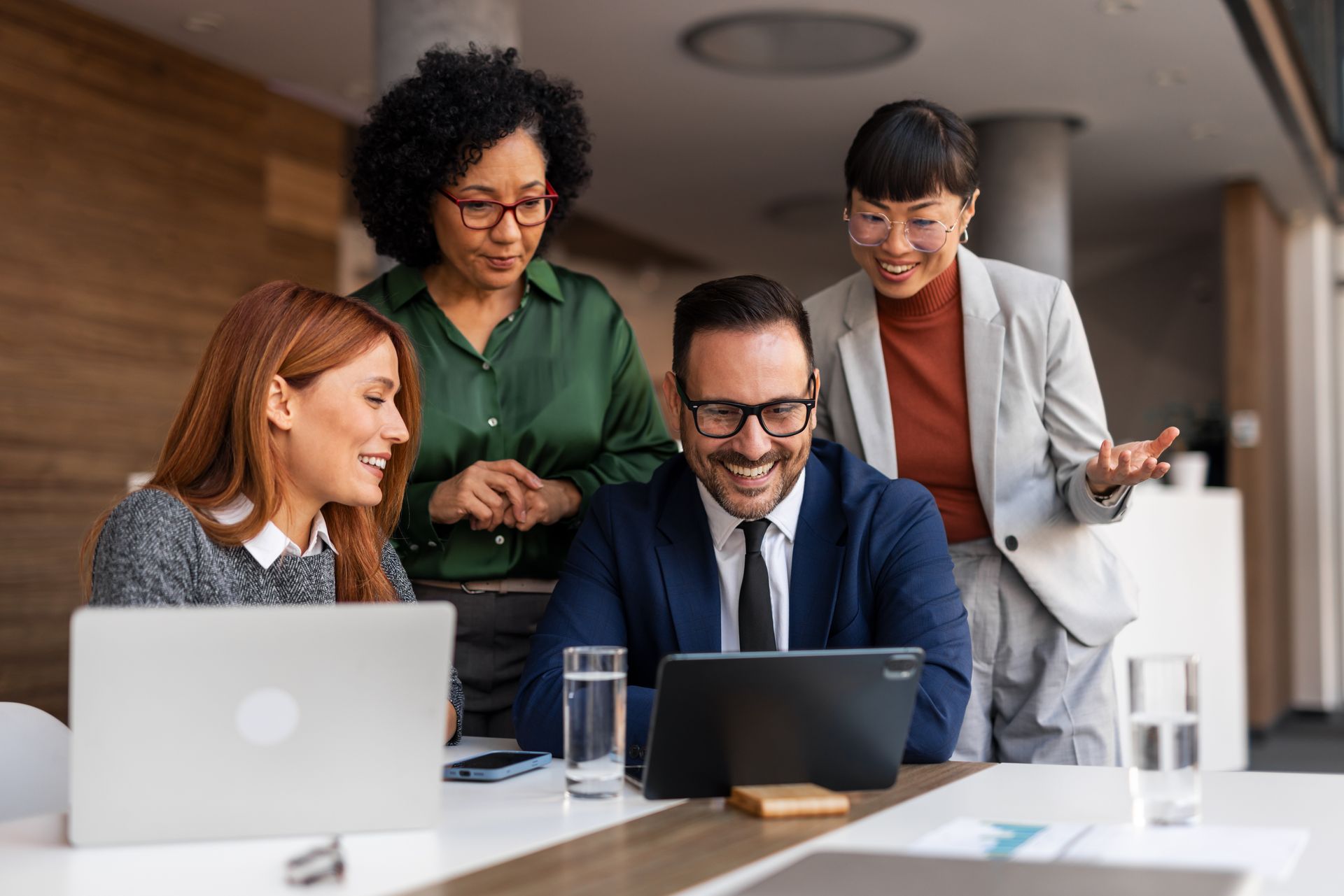 Four colleagues in a modern office
