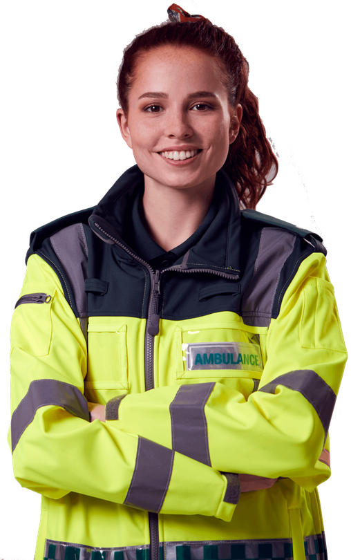 A woman in an ambulance uniform is smiling with her arms crossed.