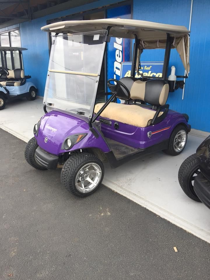 A Purple Golf Cart Is Parked in Front of A Building — DTM Tamworth in Tamworth, NSW