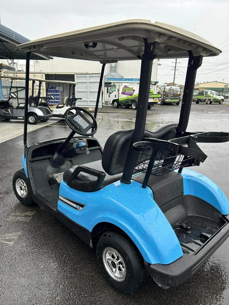 A Blue Golf Cart Is Parked in A Parking Lot — DTM Tamworth in Inverell, NSW