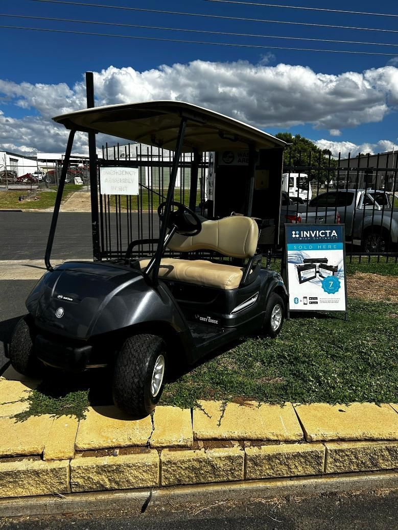 A Black Golf Cart Is Parked on The Side of The Road — DTM Tamworth in Tamworth, NSW