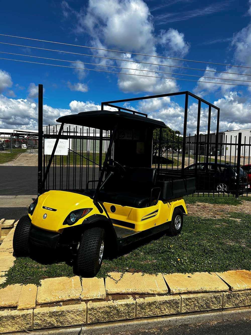 A Yellow Golf Cart In Tamworth