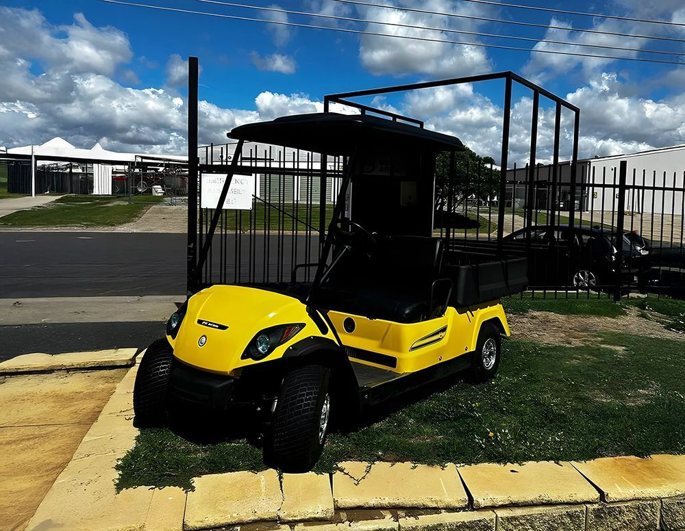 A Yellow Golf Cart In Tamworth