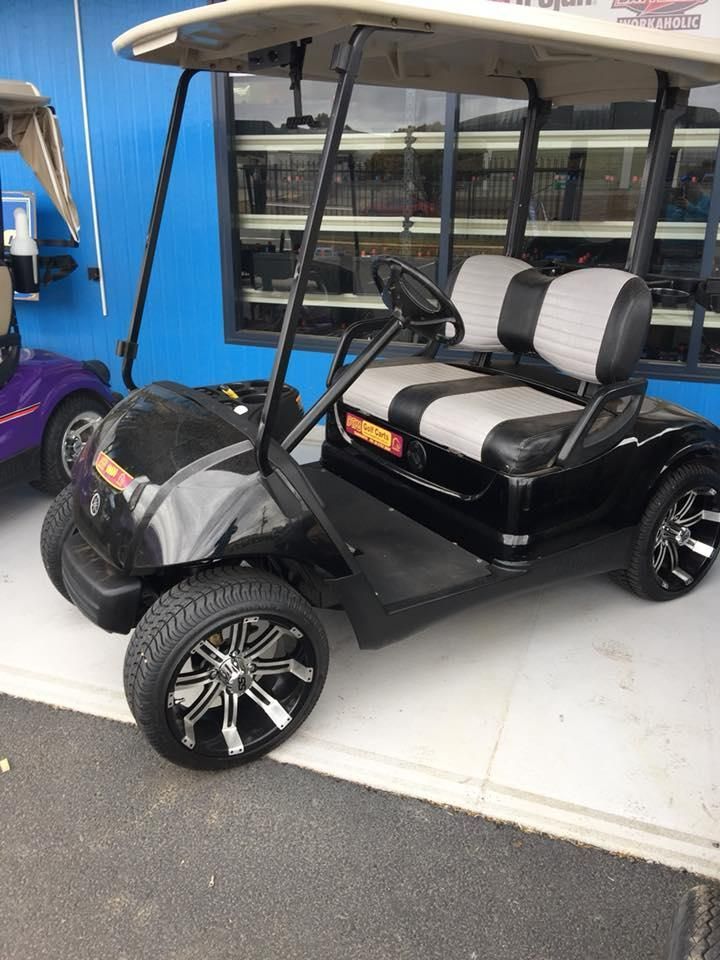 A Black and Gray Golf Cart Is Parked in Front of A Building — DTM Tamworth in Inverell, NSW