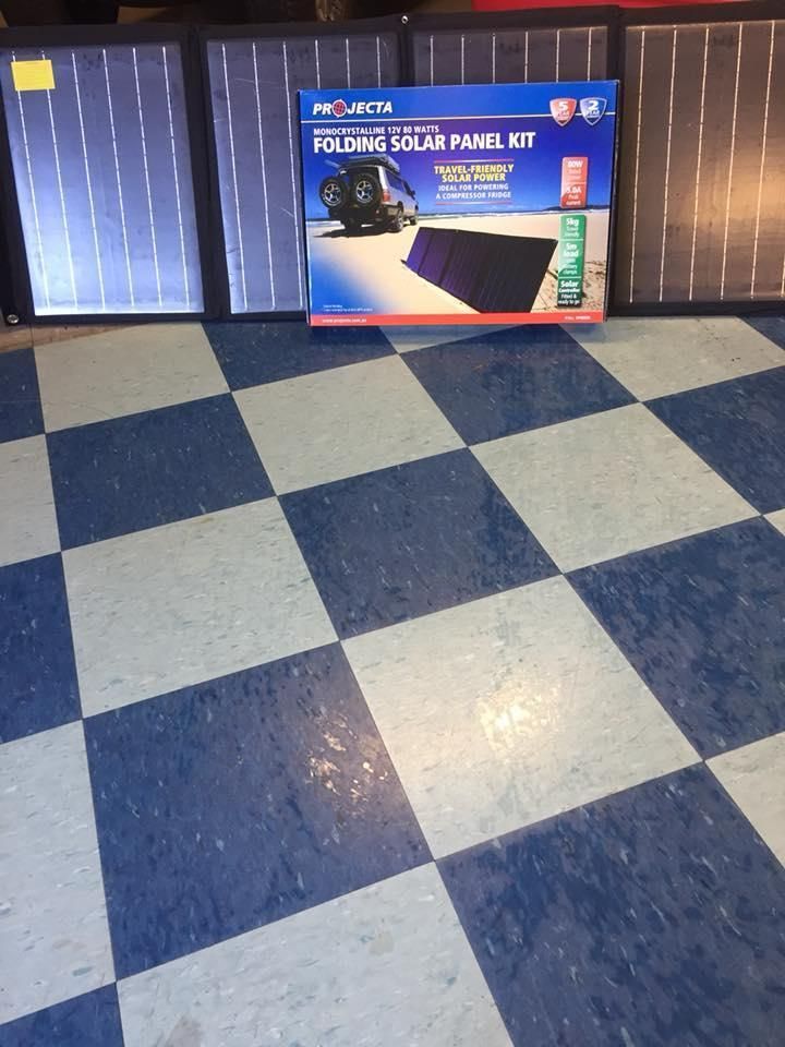 A Solar Panel Kit Is Placed on A Checkered Floor — DTM Tamworth in Tamworth, NSW