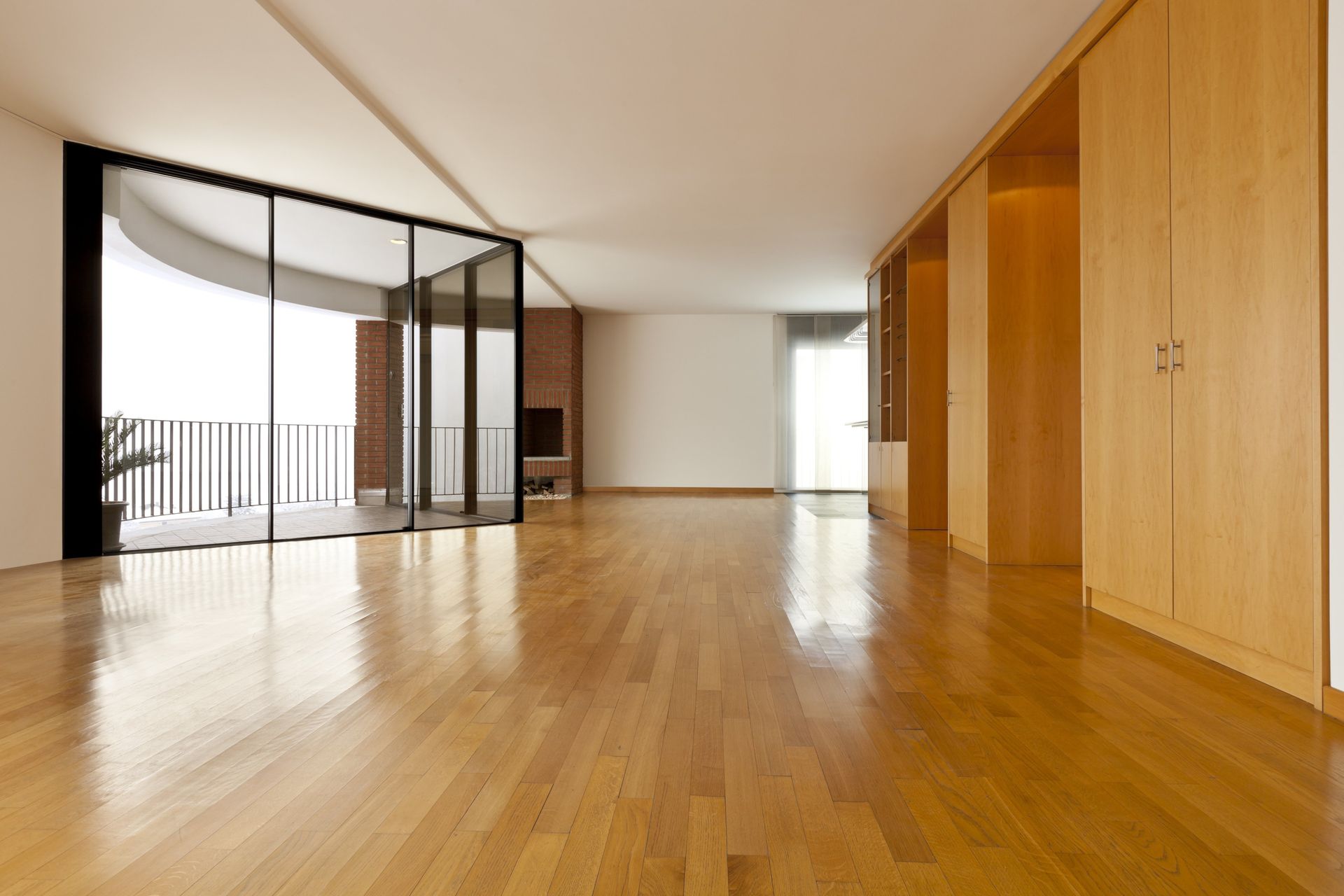 Big room with hardwood flooring