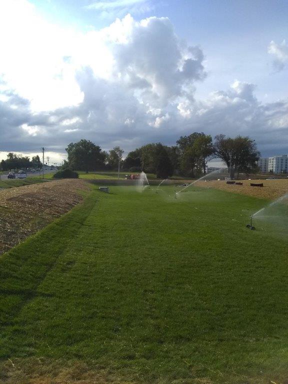 Field with Sprinklers — St. Louis, MO — Crown’s & Curbs Inc.