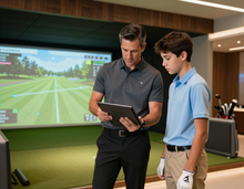 Coach and player reviewing performance data