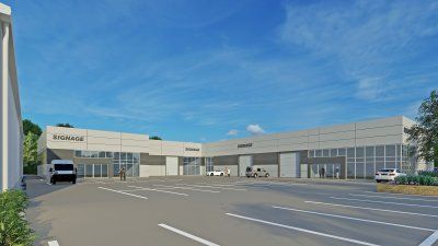 An artist 's impression of a large  Reidsteel building with a parking lot in front of it.