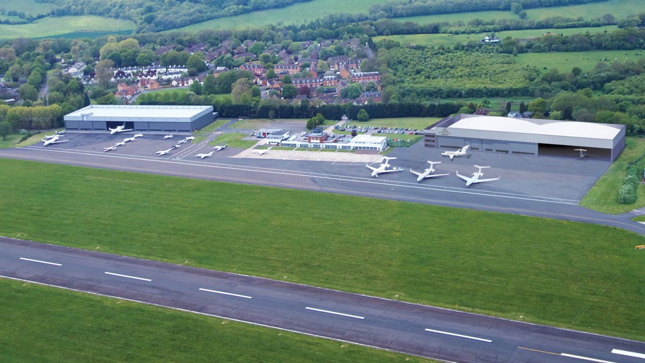 An aerial view of an airport with planes on the runway