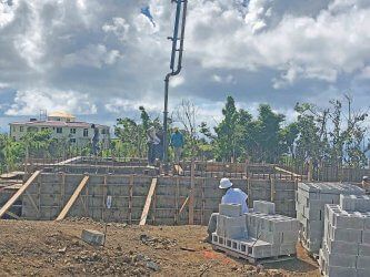 A group of people are working on a construction site.