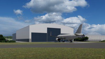 An airplane is parked in front of a hangar on a runway.