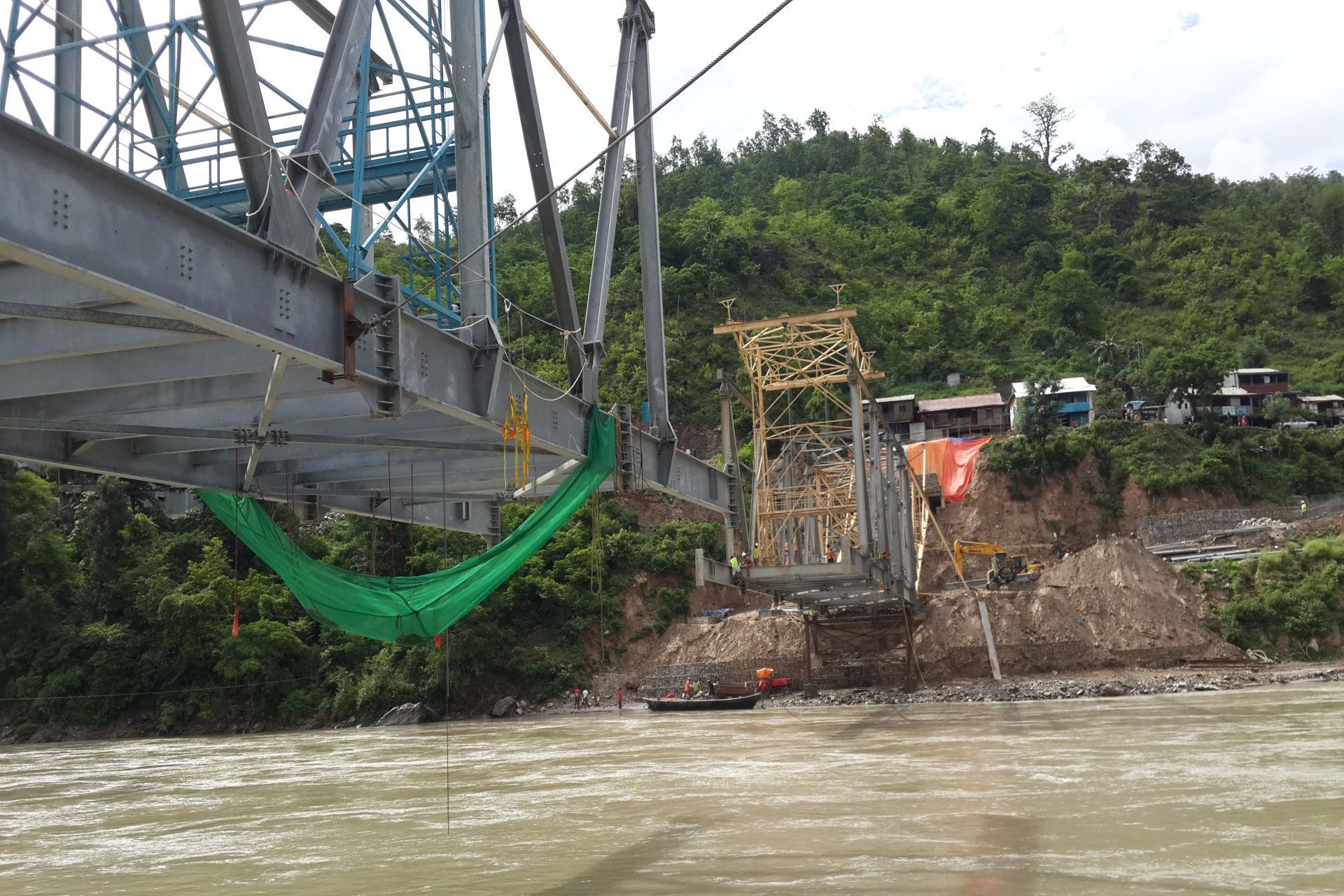 A bridge is being built over a river.