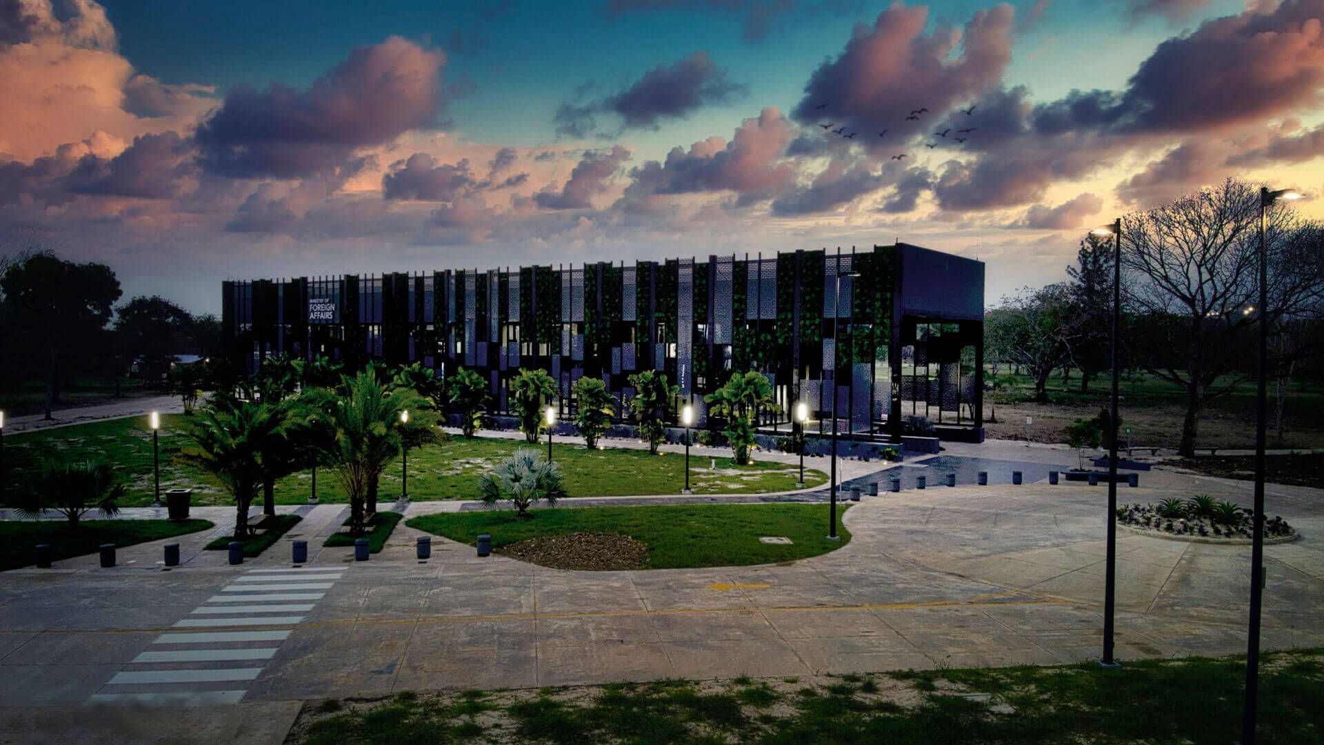 An aerial view of a large  Reidsteel building with a sunset in the background.