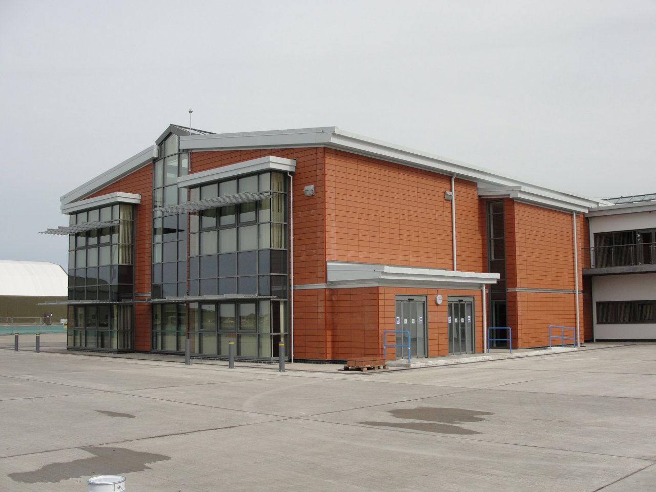 A large red brick building with a lot of windows