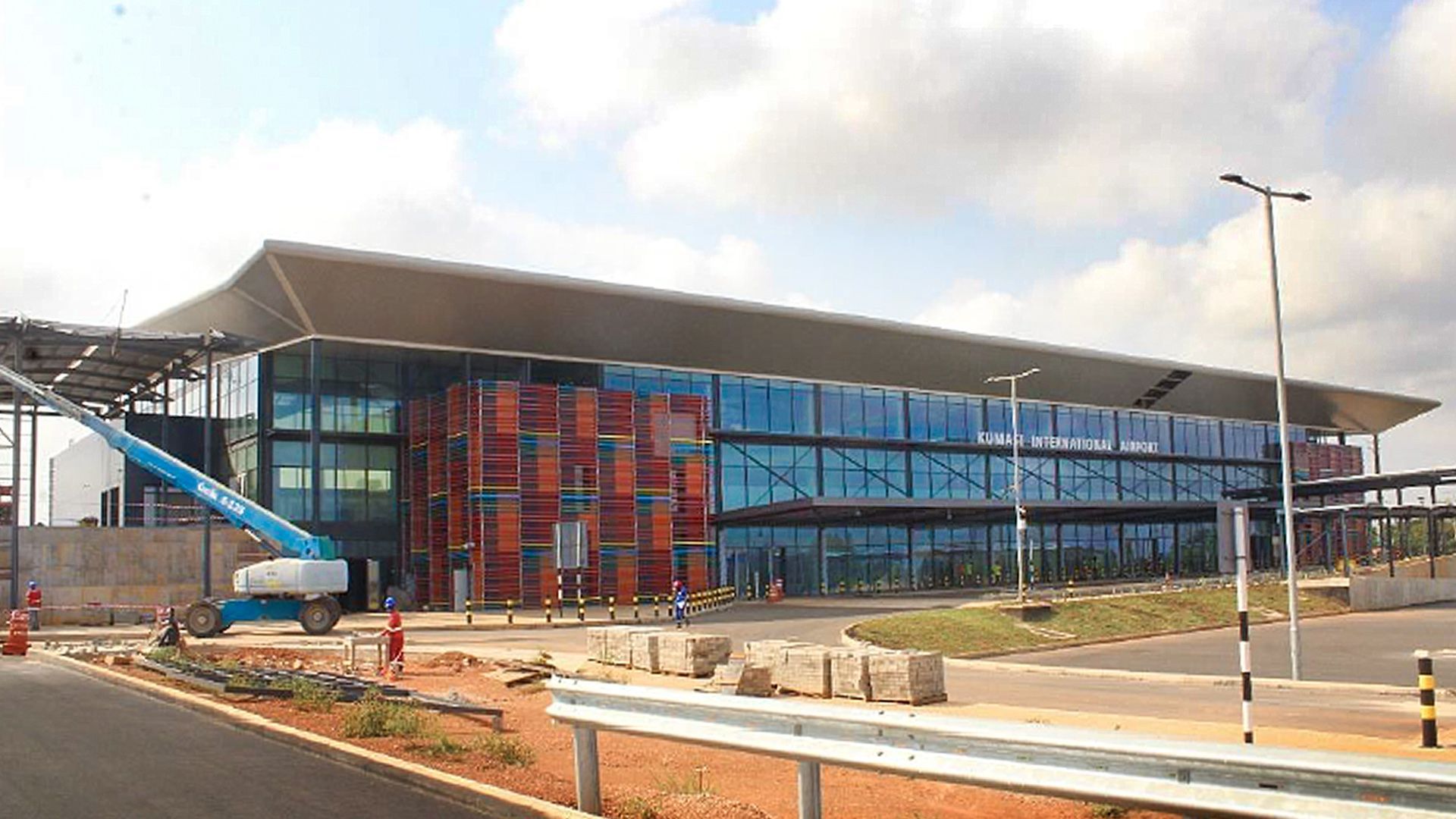 A large building with a lot of windows is under construction.