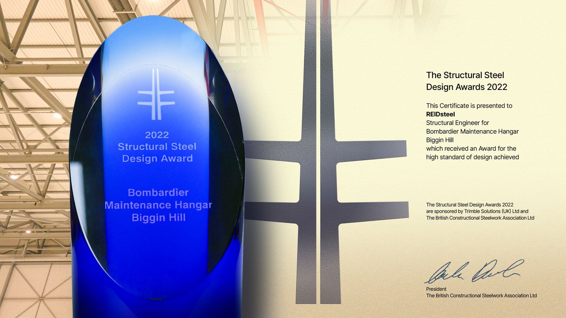 A stacked steel design award is displayed next to a certificate