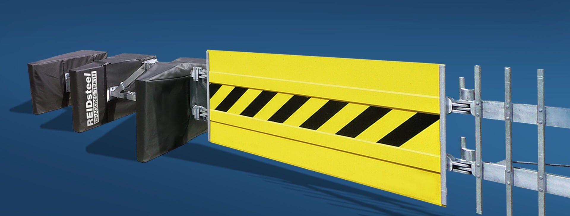 A yellow and black barrier is sitting next to a metal fence.