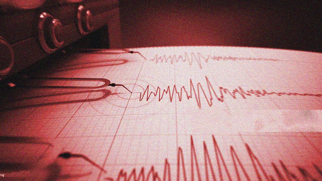 A close up of an earthquake record on a piece of paper.