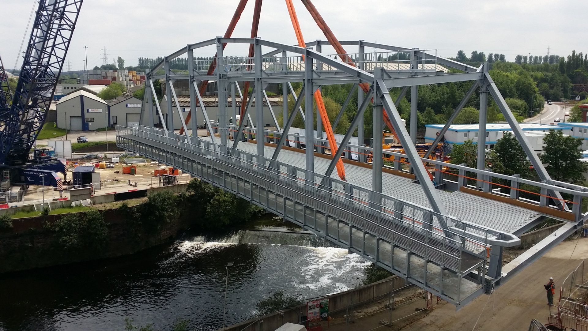 A bridge is being built over a body of water.