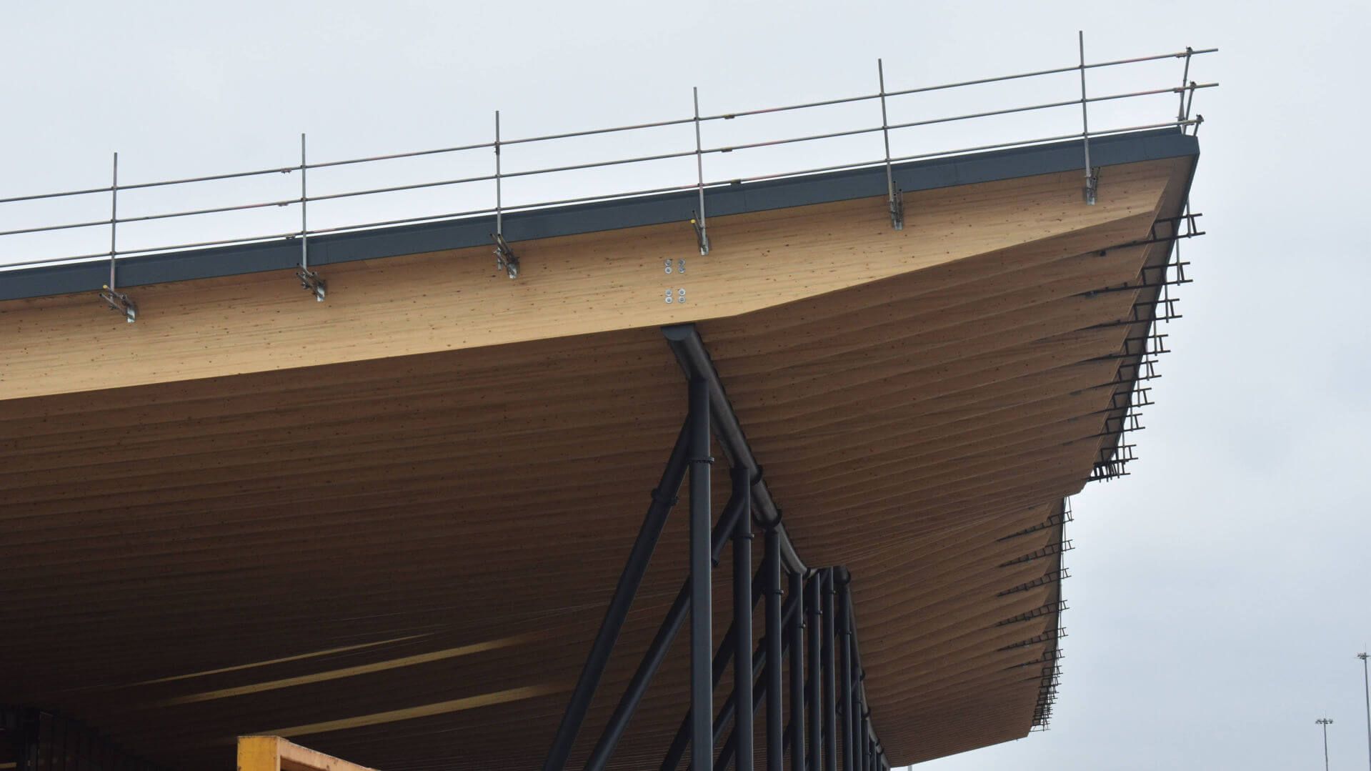 The roof of a building with a fence around it