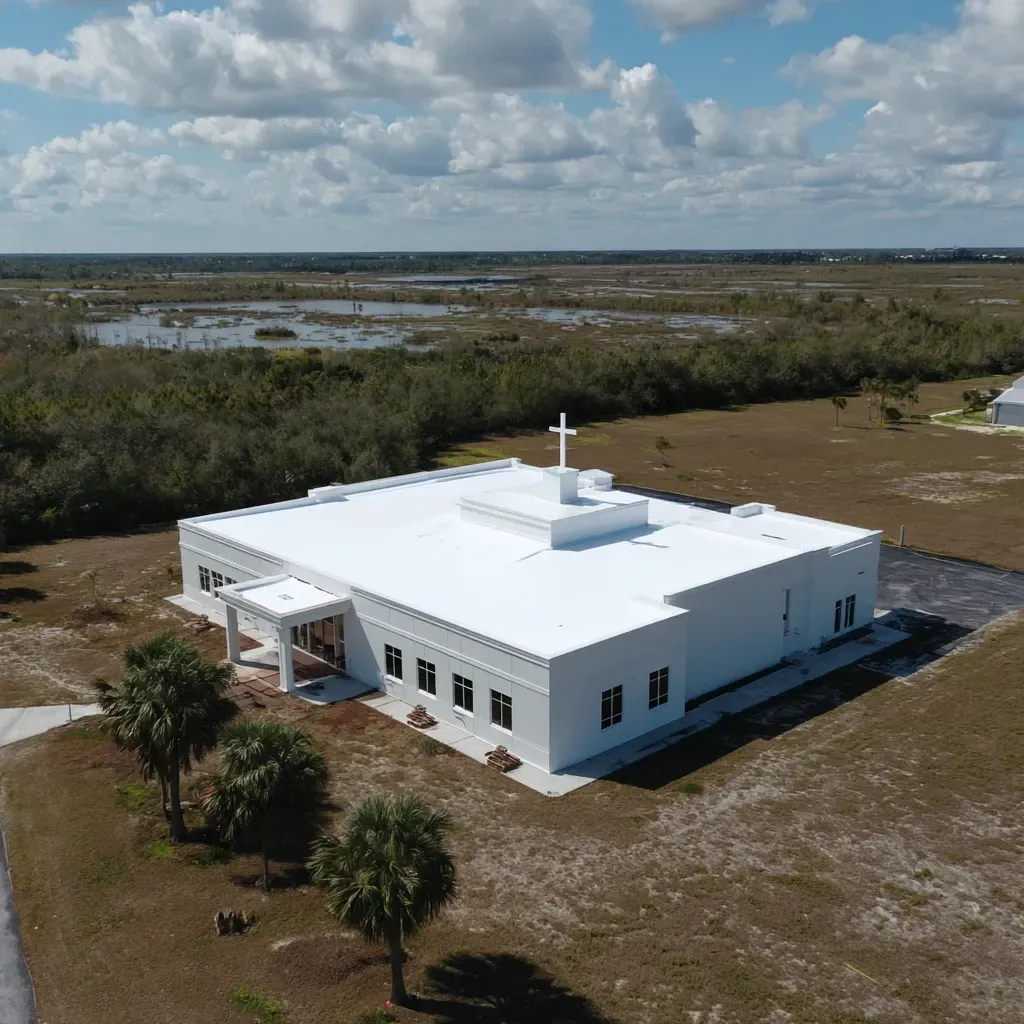 Re-roofing and new commercial flat roof installation Lehigh Acres FL with full tear-off, decking repair, and retrofit upgrades.