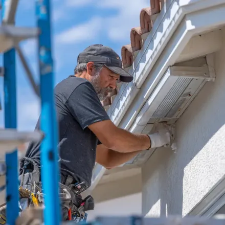 Local Lehigh Acres Florida roofing experts, storm damage roofers, and tile roof specialists replacing cracked concrete tiles and underlayment layers.