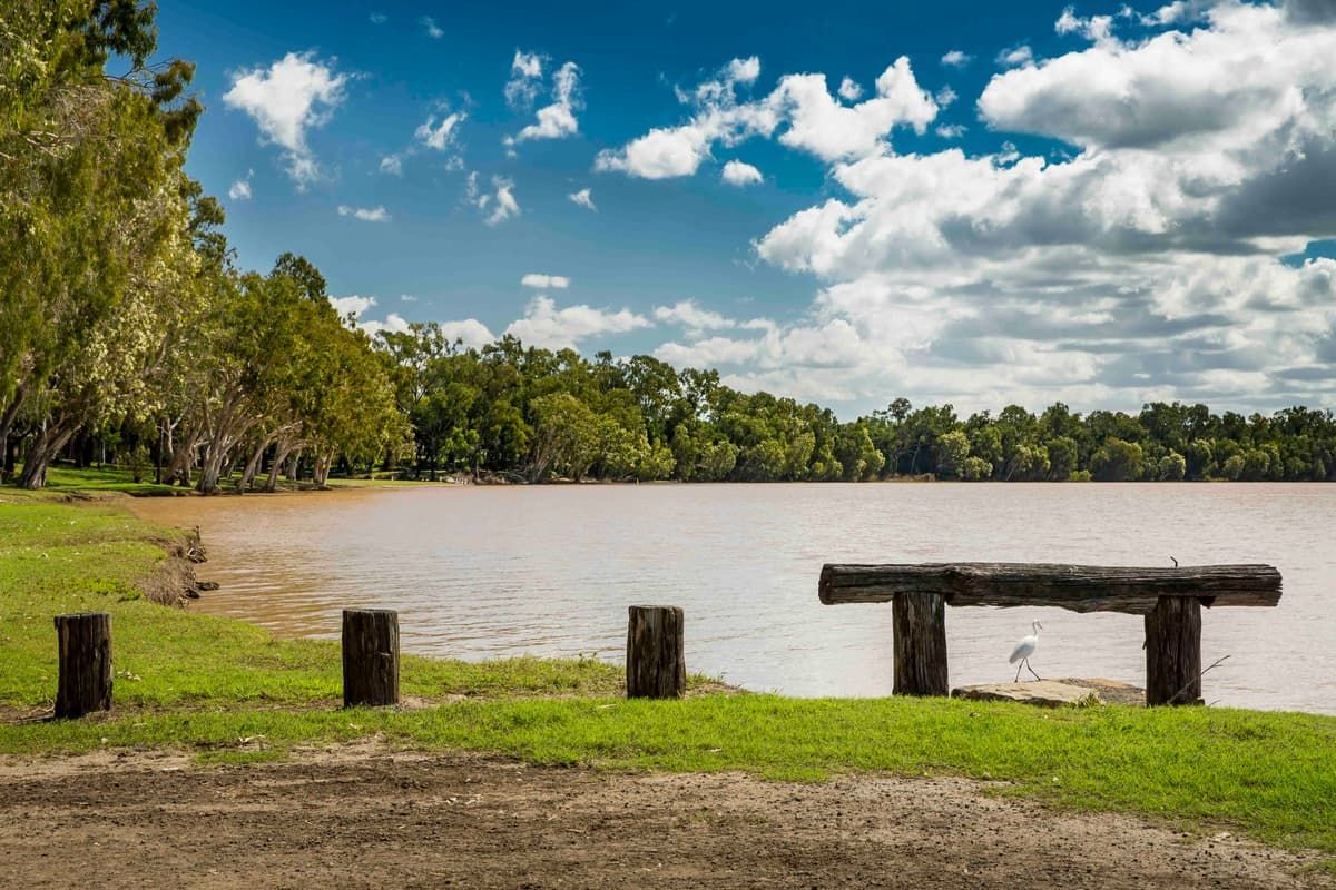 Wooden Bench is Sitting on the Shore of a Lake — MFM Soil Solutions in Rockhampton, QLD