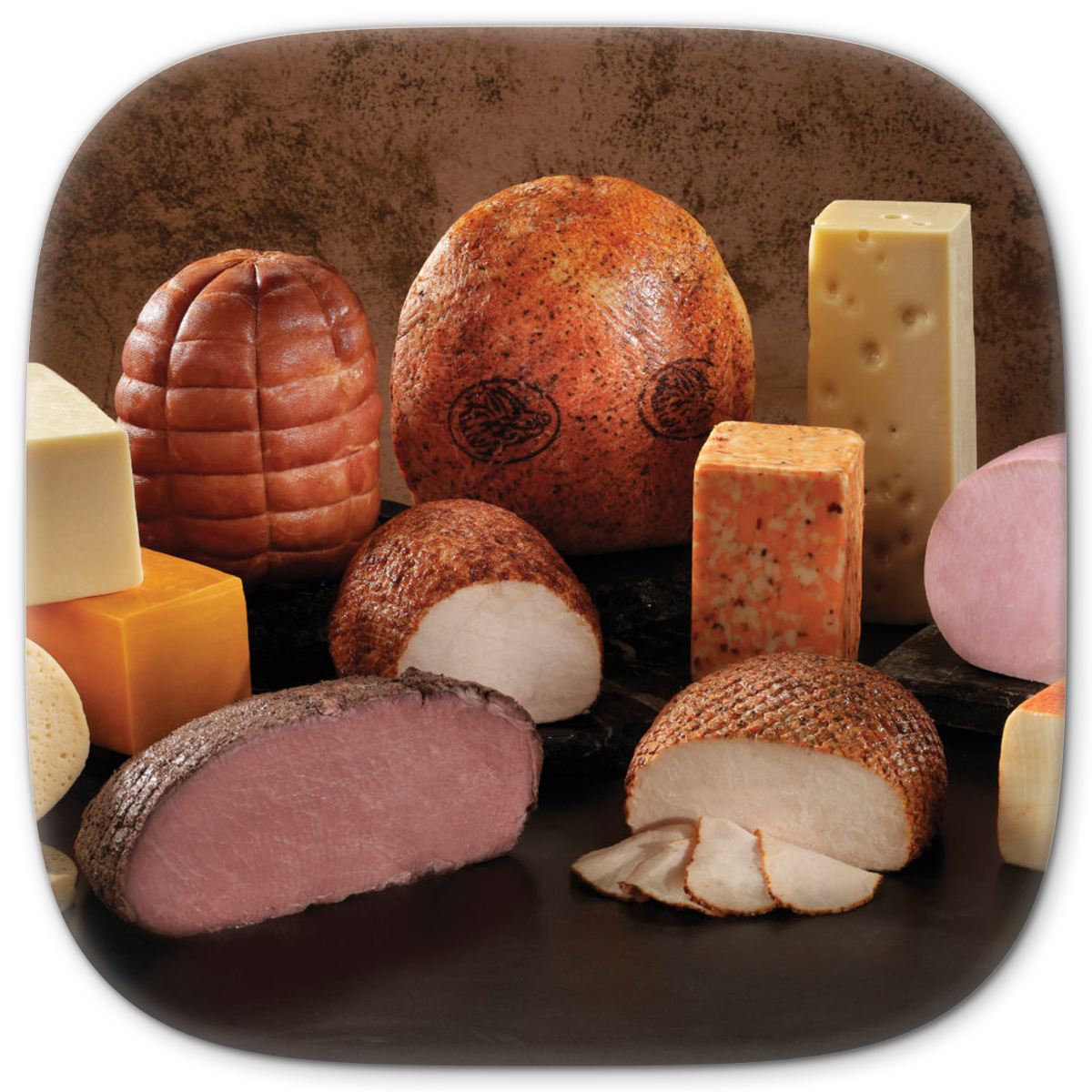 Various cheeses and deli meats on display; brown, tan, and yellow hues.