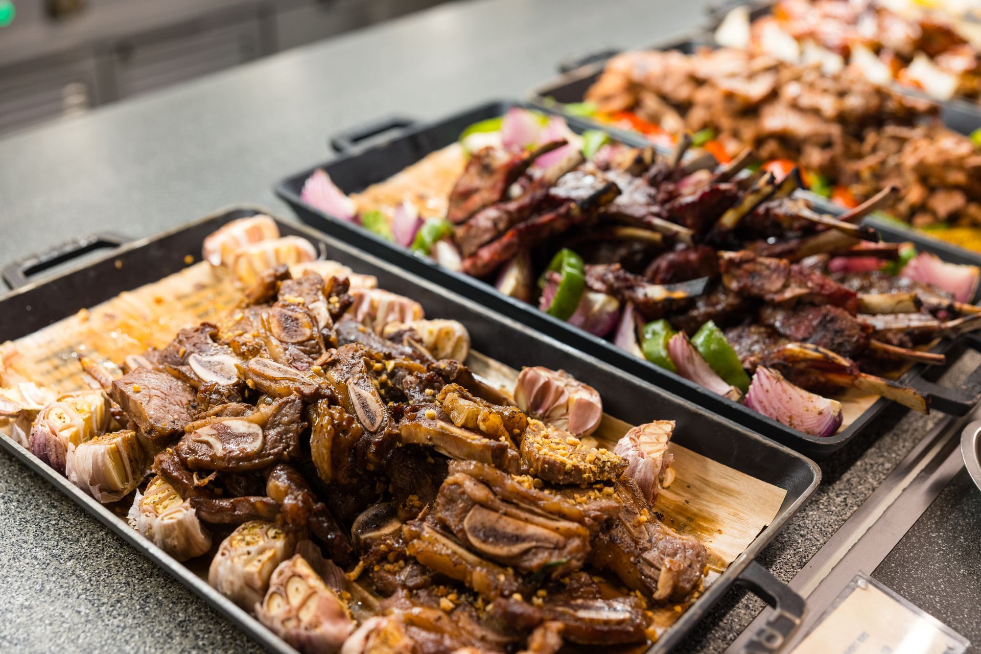 Close-up of several red apples, some with visible water droplets, on a wooden surface.