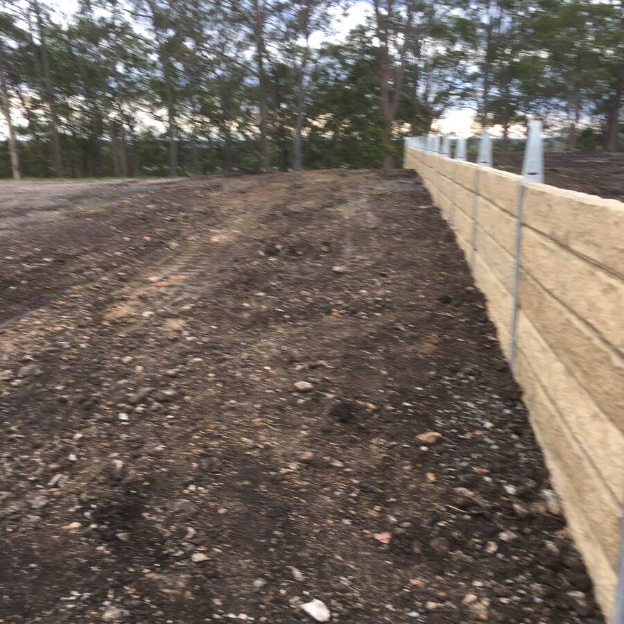 Sandstone Spiltface Retaining Wall – Subdivision— in Gold Coast, QLD