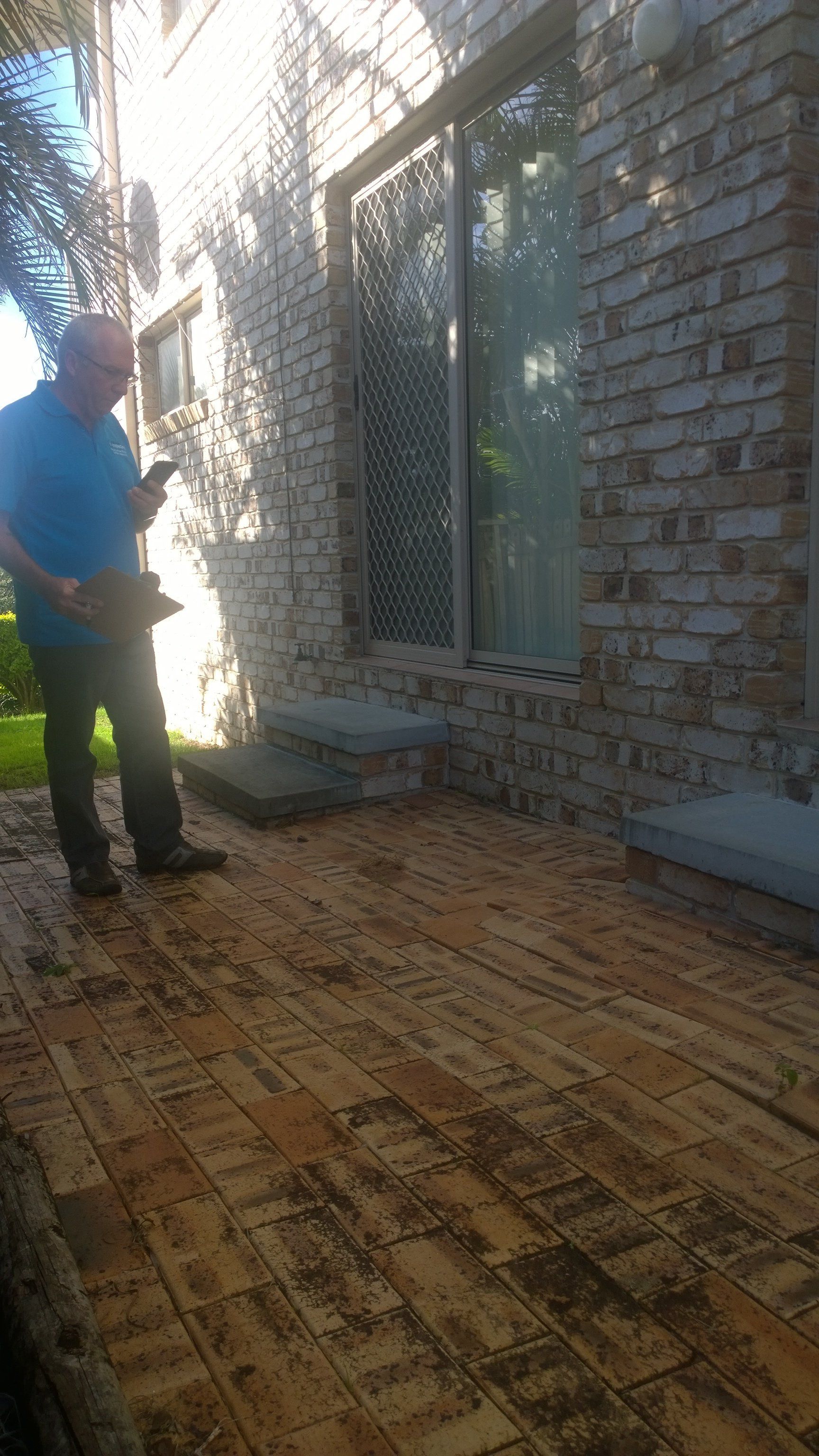 Man Inspecting a House for Pests — Pre-Purchase Building Inspectors in East Ballina, NSW