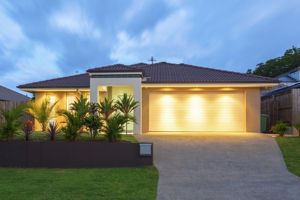 Well Lit Modern Home Exterior at Dusk — Pre-Purchase Building Inspectors in East Ballina, NSW