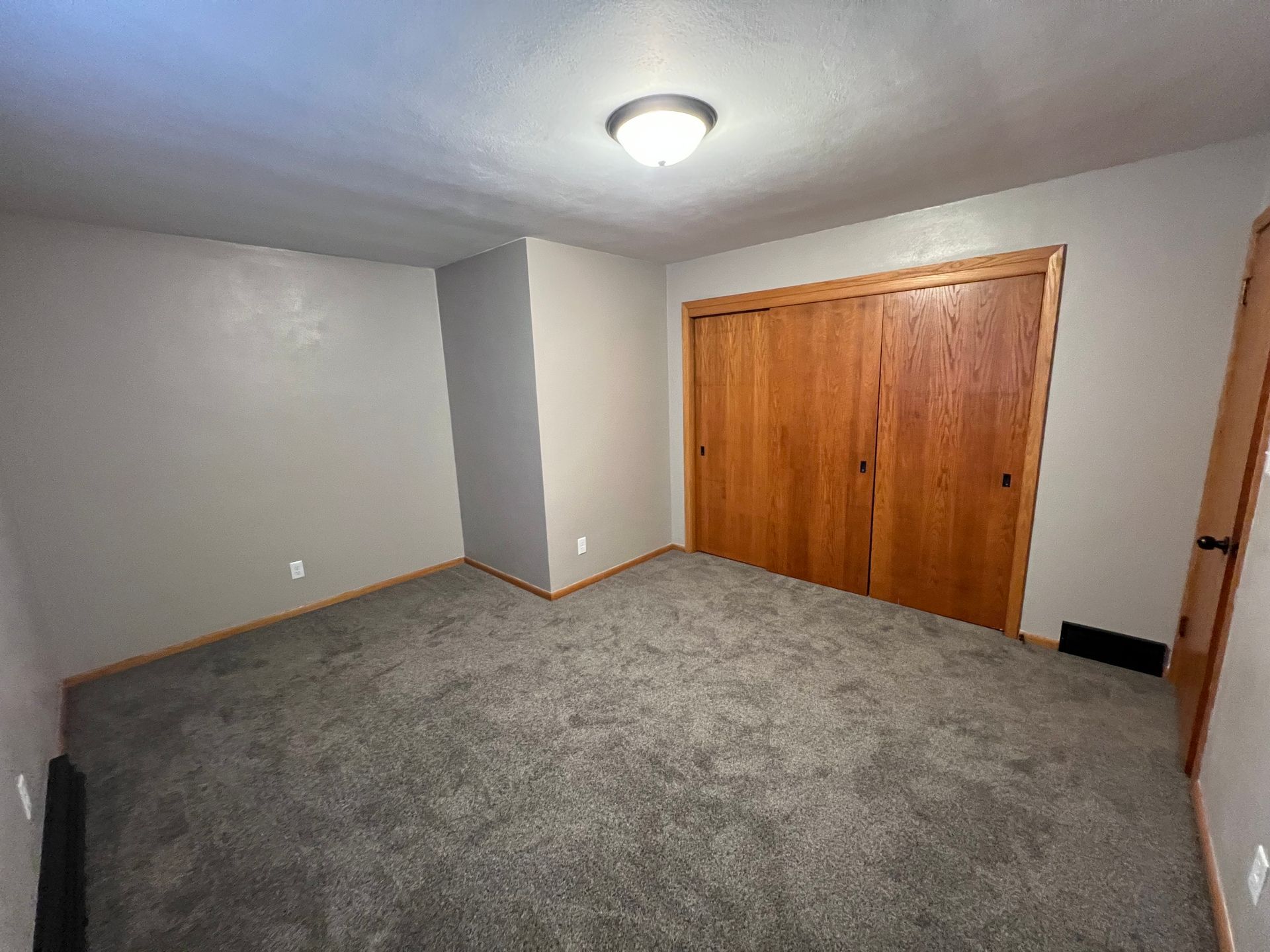 There is a large closet in the corner of the room.