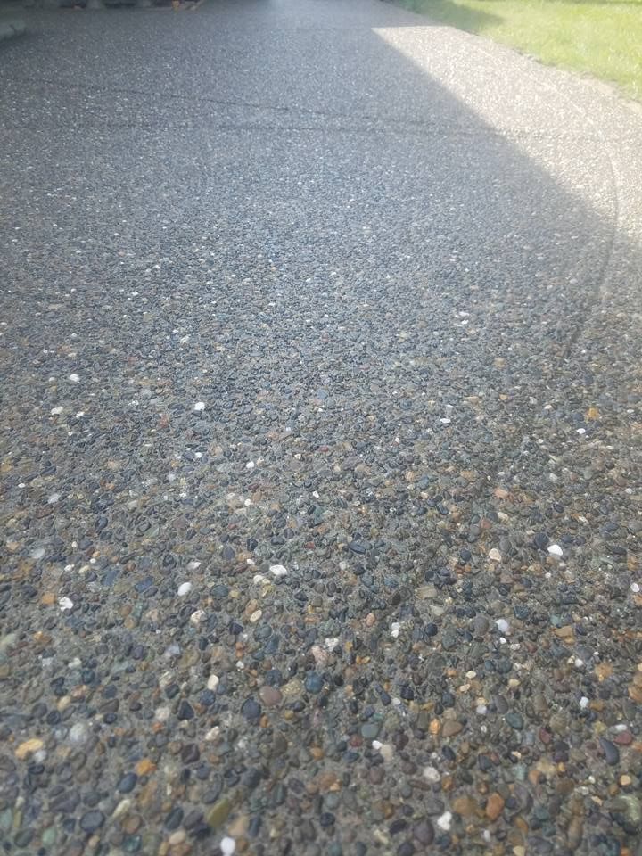 Residential concrete finish with slip resistant pebble texture