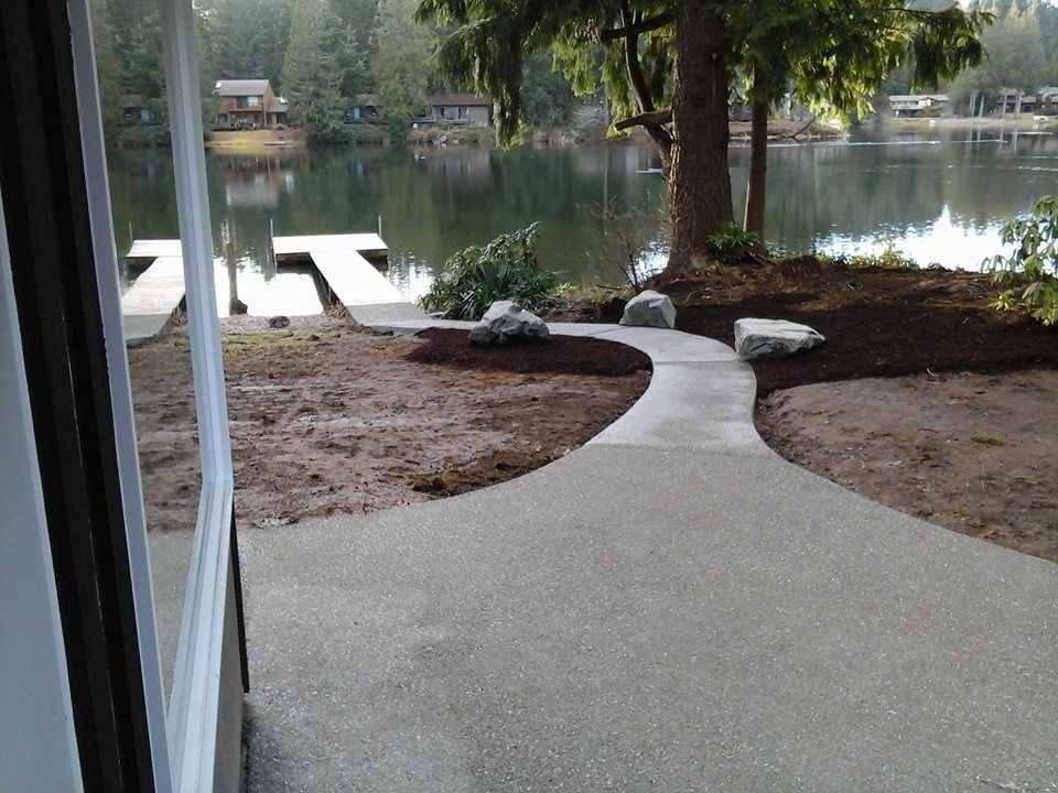 Residential waterfront sidewalk installation with smooth finish