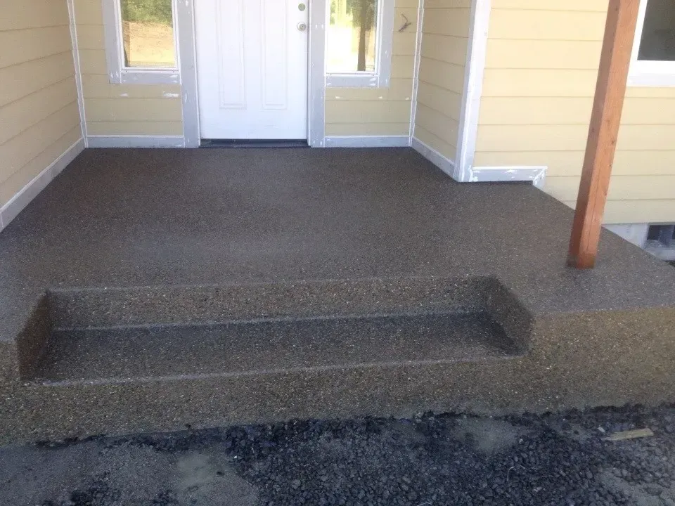 Washed aggregate concrete porch construction
