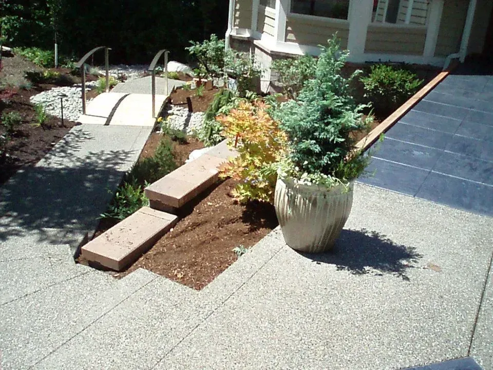 Custom concrete sidewalk with integrated planter area
