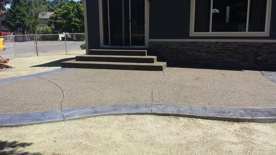 Decorative concrete steps with textured surface and curved patio edges