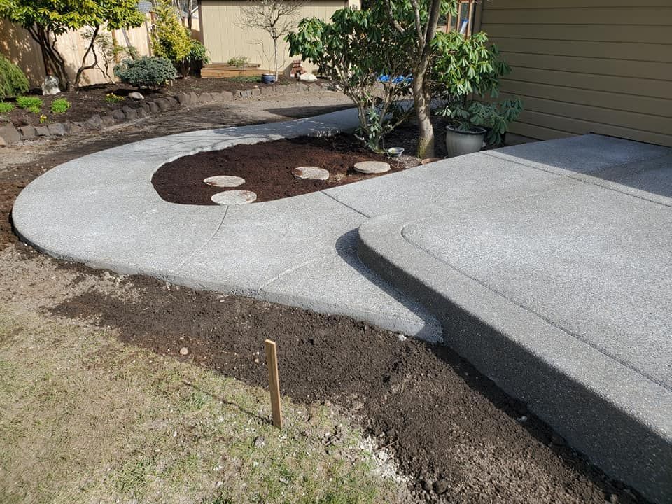 Exposed aggregate patio extension with integrated step