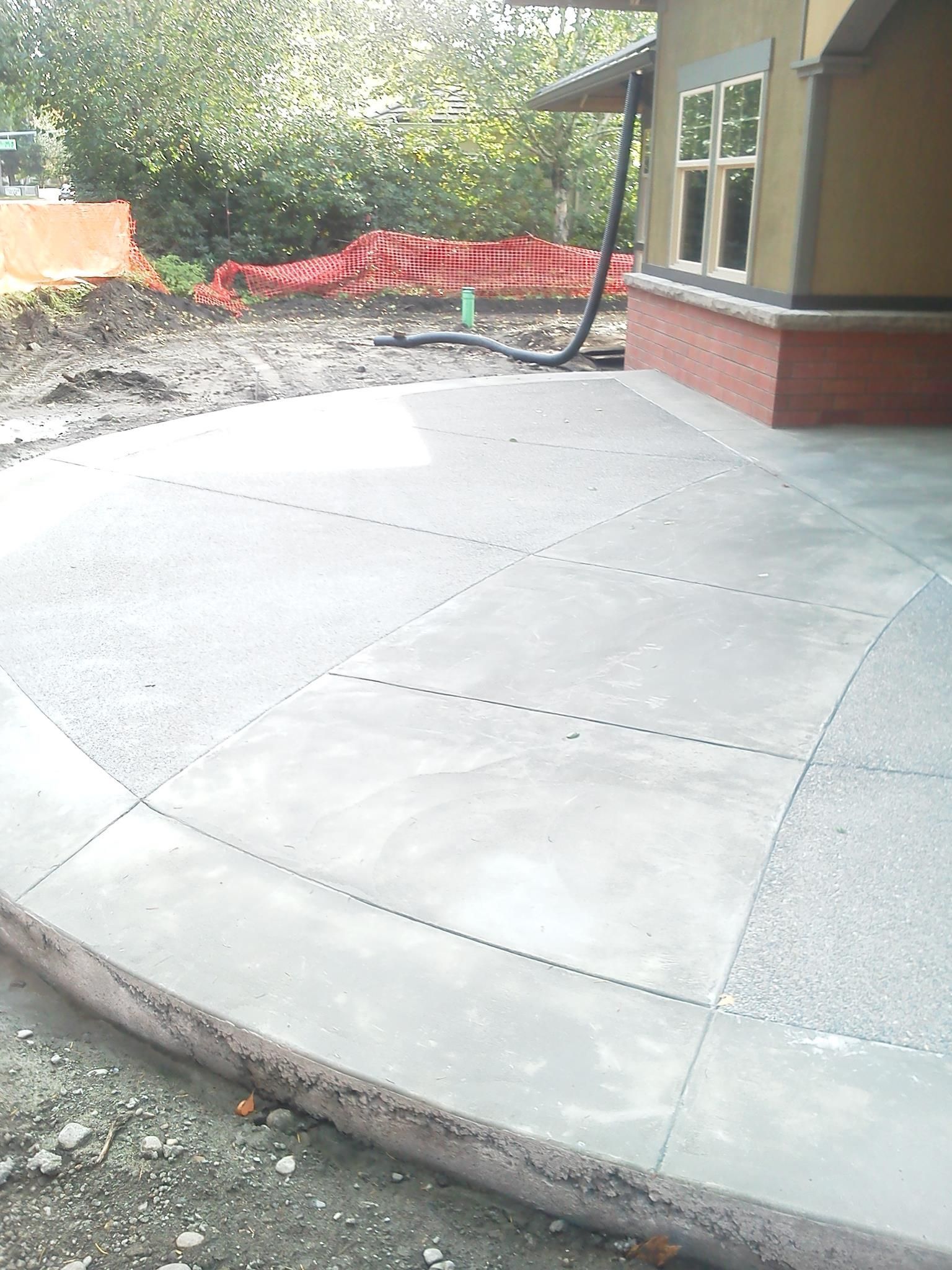 Commercial concrete entry patio with broom finish texture