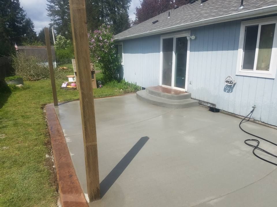 Outdoor living space featuring new concrete flatwork