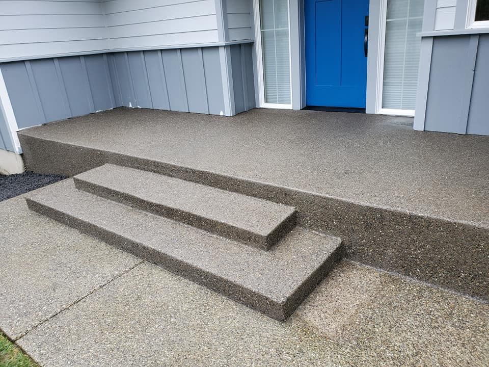 Exposed aggregate concrete porch with matching three step entry