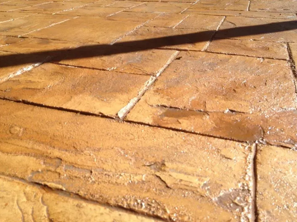 Residential outdoor patio with warm toned stamped finish